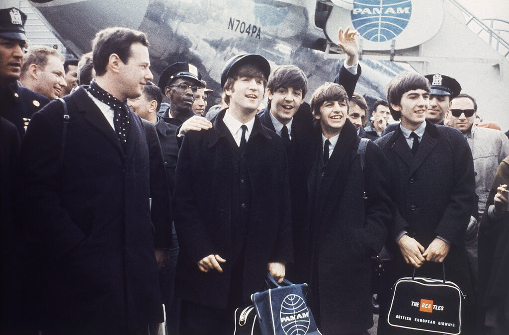 Брайън Епстейн (най-вляво) заедно с The Beatles