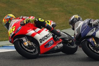 Yamaha MotoGP rider Jorge Lorenzo of Spain and Ducati MotoGP Valentino Rossi of Italy ride their bikes during the Spanish Grand Prix in Jerez