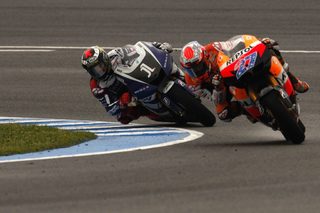Yamaha MotoGP rider Lorenzo and Honda MotoGP rider Stoner take a curve during the Spanish Grand Prix in Jerez