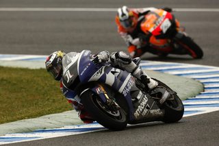 Yamaha MotoGP rider Lorenzo of Spain takes a curve ahead of compatriot Honda MotoGP rider Pedrosa during the Spanish Grand Prix in Jerez
