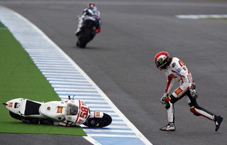 MotoGP rider Simoncelli of Italy runs to pick up his bike after crashing during the  Spanish Grand Prix in Jerez
