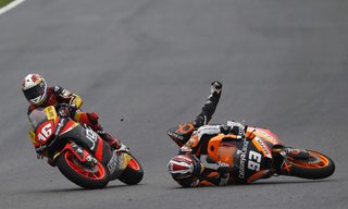 Suter Moto2 rider Marquez of Spain falls next to Suter rider Cluzel of France during the Spanish Grand Prix in Jerez