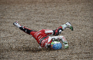 AP110403023531 Moto125 rider Efren Vazquez, from Spain, falls, during the Moto125.jpg