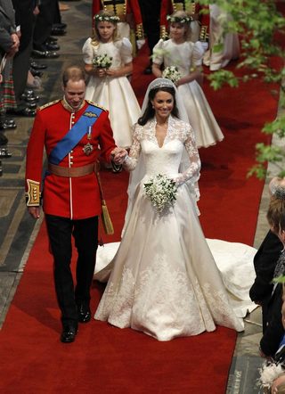Britain's Prince William and Catherine, Duchess of Cambridge, walk up the aisle after their wedding ceremony in Westminster Abbey, in central London