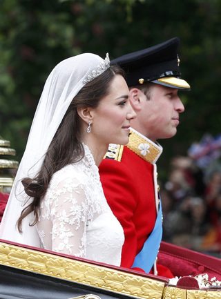 Britain's Prince William and Catherine Duchess of Cambridge travel to Buckingham Palace along Procession Route after their wedding in Westminster Abbey in London
