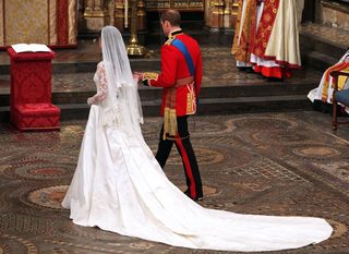 Britain's Prince William, and Kate Middleton sit during their wedding ceremony In Westminster Abbey, in central London