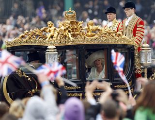 Camilla, Duchess of Cornwall, travels to Buckingham Palace along the Procession Route after the wedding of Prince William and Kate Middleton in Westminster Abbey, in central London