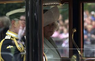 Britain's Prince Charles and Camilla Duchess of Cornwall travel to Buckingham Palace in Semi-State Landau along Procession Route after wedding of Prince William and Kate Middleton in Westminster Abbey in London