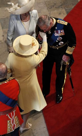 ritain's Prince Charles kisses the hand of his mother, Britain's Queen Elizabeth in Westminster Abbey before the wedding of Britain's Prince William and Kate Middleton in central London
