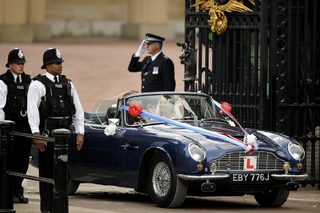 Britain's Prince William and his wife Catherine, Duchess of Cambridge drive from Buckingham Palace in an Aston Martin DB6 Mark 2, after their wedding in Westminster Abbey, in central London