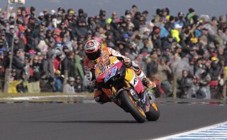 Honda MotoGP rider Stoner of Australia rides to win the Australian Grand Prix on Phillip Island near Melbourne