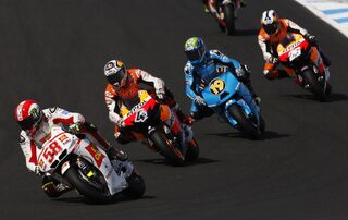 Simoncelli of Italy rides in front of Dovizioso of Italy, Bautista of Spain and Pedrosa of Spain during the Australian Grand Prix on Phillip Island