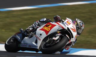 Honda MotoGP rider Aoyama rides during the first practice session of the Australian Grand Prix on Phillip Island