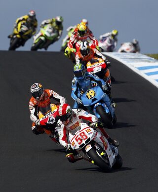 Honda MotoGP rider Marco Simoncelli of Italy rides in third place during the first lap of the Australian Grand Prix on Phillip Island near Melbourne