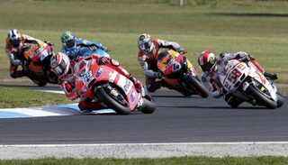 Ducati MotoGP rider Nicky Hayden of U.S. rides ahead of Honda MotoGP rider Marco Simoncelli of Italy during the Australian Grand Prix on Phillip Island near Melbourne
