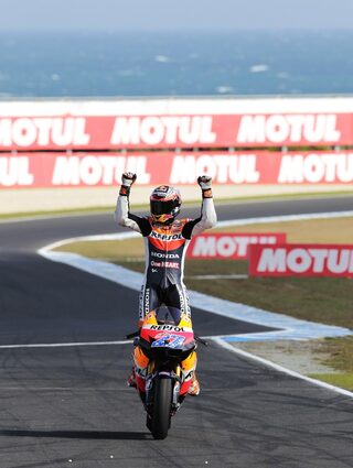Honda MotoGP rider Casey Stoner of Australia celebrates after winning the Australian Grand Prix on Phillip Island