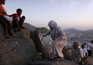 Muslim pilgrims climb towards Hera cave at the top of Mount Al-Noor during the annual haj pilgrimage in Mecca