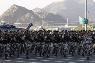 Saudi security forces march during a parade in preparation for the annual haj pilgrimage, in Mecca