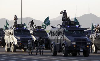 Members of the Saudi security forces perform during a military parade in preparation for the annual haj pilgrimage in Mecca