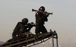Members of the Saudi security forces perform during a military parade in preparation for the annual haj pilgrimage in Mecca