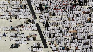 Muslim pilgrims attend Friday prayers at the Grand mosque in Mecca