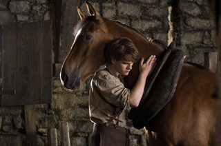 Publicity photo of actor Jeremy Irvine in scene for Oscar nominated film "War Horse"