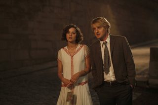 Marion Cotillard and Owen Wilson are shown in a scene from "Midnight in Paris" in this publicity photo