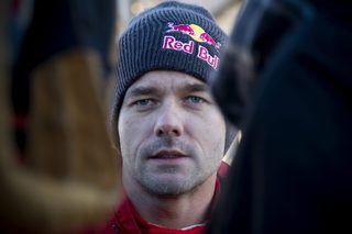 France's Loeb, who drives a Citroen DS3 WRC, looks on during the qualification for the World Rally Championship Rally Sweden in Hagfors