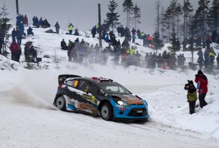 Norway's Ostberg and co-driver Andersson compete with their Ford Fiesta RS WRC during the World Rally Championship Rally Sweden in Hagfors