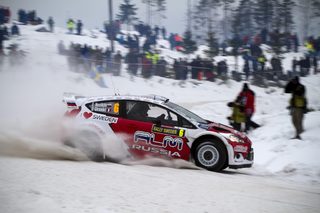 Russia's Novikov and co-driver Giraudet of France compete in their Ford Fiesta RS WRC during the 12th stage of the World Rally Championship Rally Sweden in Hagfors