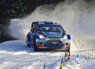 Finland's Jari-Matti Latvala and his co-driver Miika Anttila drive towards victory in their Ford Fiesta RS WRC during the 21st and last stage of the WRC Rally of Sweden in Hagfors