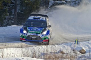 Finland's Jari-Matti Latvala and his co-driver Miika Anttila drive towards victory in their Ford Fiesta RS WRC during the 21st and last stage of the WRC Rally of Sweden in Hagfors