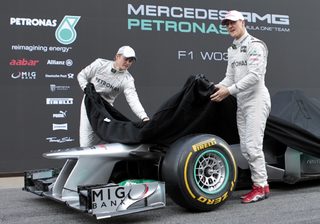 Mercedes Formula One drivers Schumacher of Germany and compatriot Rosberg unveil the F1 Mercedes W03 during the presentation at Circuit de Catalunya racetrack in Montmelo