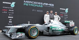 Mercedes Formula One drivers Schumacher of Germany, compatriot Rosberg and team principal Brawn pose during the F1 Mercedes W03 presentation at Circuit de Catalunya racetrack in Montmelo
