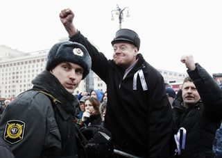 Opposition supporters take part in a protest rally in central Moscow