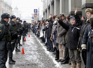 Opposition supporters take part in a protest rally called The White Ring by forming a human chain along the Garden Ring road in Moscow