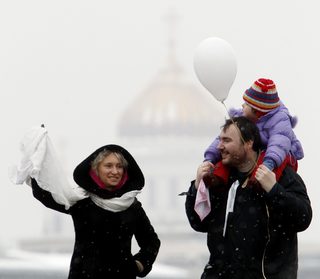 Opposition supporters take part in a protest rally called The White Ring along the Garden Ring road in Moscow
