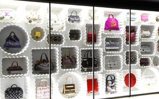 Fashion creations bags are displayed at  the 'Louis Vuitton - Marc Jacobs: The Exhibition' at the Museem of Decorative Arts in Paris