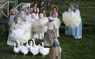 Actors and geese stand in a pen set up for the opening ceremony of the London 2012 Olympic Games at the Olympic Stadium