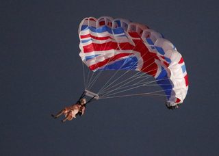 A performer playing the role of Britain's Queen Elizabeth parachutes from a helicopter during the opening ceremony of the London 2012 Olympic Games at the Olympic Stadium