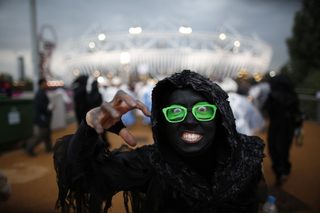 A performer gestures before the start of the opening ceremony of London 2012 Olympic Games in the Olympic Stadium at the Olympic Park in London