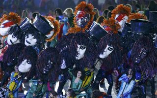 Performers take part in the opening ceremony of the London 2012 Olympic Games at the Olympic Stadium