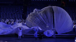 Performers take part in the opening ceremony of the London 2012 Olympic Games at the Olympic Stadium