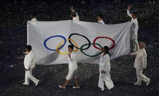 The Olympic flag is carried during the opening ceremony of the London 2012 Olympic Games
