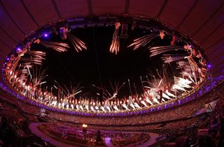 The Olympic cauldron is seen alight as fireworks are set off during the opening ceremony of the London 2012 Olympic Games