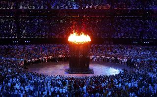 The Olympic cauldron is seen alight during the opening ceremony of the London 2012 Olympic Games