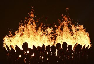 Flames leap from the cauldron during the opening ceremony of the London 2012 Olympic Games at the Olympic Stadium