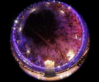 Fireworks explode after the Olympic cauldron was lit during the opening ceremony of the London 2012 Olympic Games at the Olympic Stadium