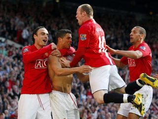 Manchester United's Ronaldo celebrates with Berbatov, Rooney and Ferdinand after scoring during their English Premier League soccer match against Tottenham Hotspur in Manchester