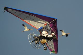 Russian President Vladimir Putin flies in a motorized deltaplane at Yamalo-Nenets district